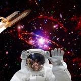Fototapeta Kosmos - Astronaut posing. Rocket on the backdrop. The elements of this image furnished by NASA.