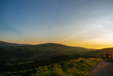 Fototapeta Niebo - Colorful sunset at Cave Hill Country Park Belfast, Northern Ireland. Aerial view on City and hills 