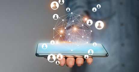 Poster - Virtual people icons coming out of smartphone in male hand