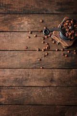 Wall Mural - Old coffee grinder on wooden table with copyspace