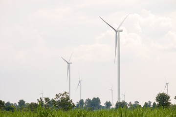 Wind turbine farm power generator in beautiful nature landscape for production of renewable green energy is friendly industry to environment.