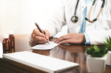 Doctor giving prescription to patient