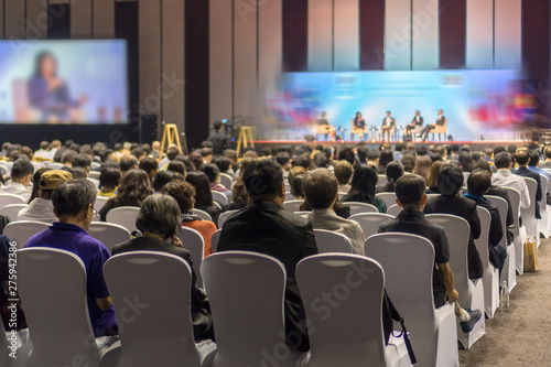 Fotomural Rear view of Audience listening Speakers on the stage in the conference hall or