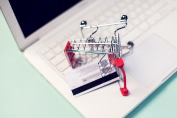 Laptop with shopping trolley. Online shopping concept