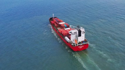 Wall Mural - Aerial view of container cargo ship in sea.