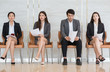 © saksit - Asian business people are stressed about waiting for a job interview.