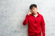 © Asier - Young sport fitness chinese thinking about an idea