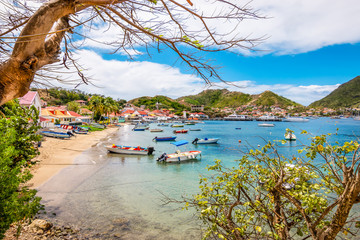 Fototapete - Landscape with small beach and bay with boats. Terre-de-Haut, Les Saintes, Iles des Saintes, Guadeloupe, French Antilles, Caribbean. 