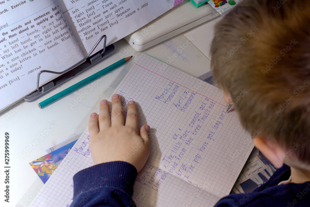 Photo Stock Close-up of boy hand with pencil writing english words by ...