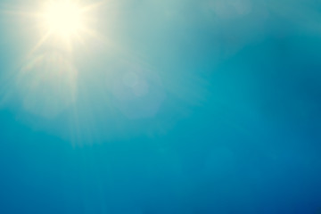 clear blue sky background with bright sun beams from natural sunlight