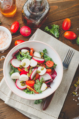 Wall Mural - Salad with cherry tomatoes, radsh and mozzarella, lettuce mix