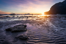Tropical Beach In Ebb Time Low Tide On Sunset. Mudflats And Sun Reflections At The Golden Hour. Mountain Chain Isles At Horizon. Coron Corong Beach, El Nido, Phillipines