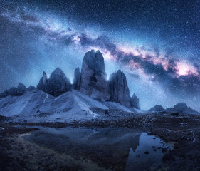 Wall Mural - milky way over mountains at night in summer. colorful landscape with alpine mountains, lake, blue sk