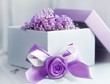 Box with ribbon and blooming lilac. Gift design in lilac color.