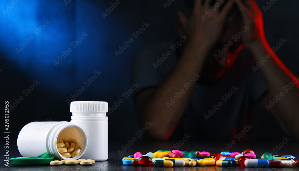 Drugs and the figure of a addicted man - obrazy, fototapety, plakaty 