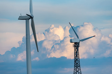 The wind turbine power working, blue sky, energy power concept