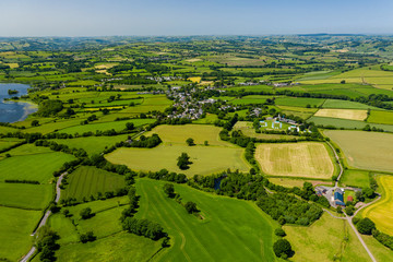 Aerial drone view of green fields and farmland in rural Wales