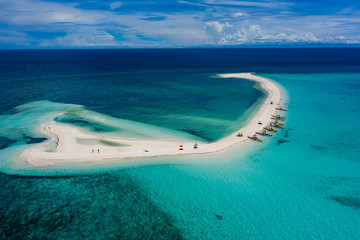Wall Mural - Aerial drone view of a beautiful white sandbar surrounded by coral reef near a tropical island (White Island, Camiguin)