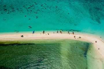 Wall Mural - Aerial drone view of a beautiful white sandbar surrounded by coral reef near a tropical island (White Island, Camiguin)