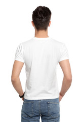 Wall Mural - Young man in t-shirt on white background. Mock up for design