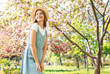 © Pixel-Shot - Beautiful young woman in park on spring day