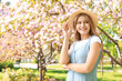 © Pixel-Shot - Beautiful young woman in park on spring day