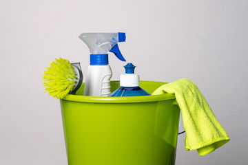 Cleaning products in green bucket