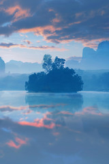 Wall Mural - Vertical image of Lake view a Baan Nong Thale in Krabi, Thailand during sunrise with beautiful cloud.