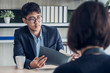 © weedezign - interviewer see qualification of interview candidate that apply for job at meeting room in office
