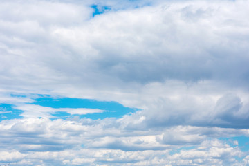 Wall Mural - Beautiful white cumulonimbus clouds against the background of the bright blue sky