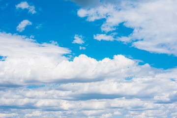 Wall Mural - Beautiful white cumulonimbus clouds against the background of the bright blue sky