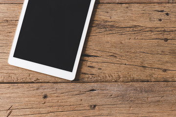 Wall Mural - Top view of Pen, notebook, glasses, tablet on wooden table and copy space