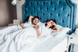 © Тарас Нагирняк - Young  married couple having romantic times in bedroom, sleeping in the weekend. Hotel apartament.