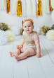 © kaloriya - Little happy toddler girl celebrating first birthday