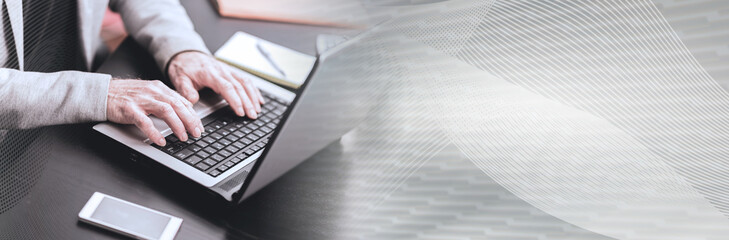 Hands of businessman using laptop. panoramic banner