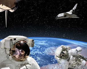 Wall Mural - astronauts and spaceships against earth. the elements of this image furnished by nasa.