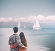© StockPhotoPro - Romantic young couple hugging at the lake