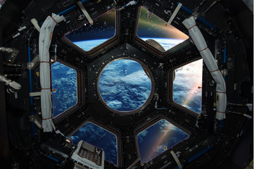 Wall Mural - Fascinating sunrise on earth. Spaceship window view. Elements of this image furnished by NASA.