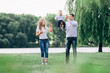 © yurolaitsalbert - happy parents with their little son walking together in spring Park