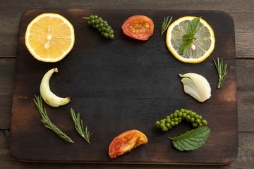 Wall Mural - fresh lemon and spices on board