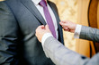 © Валентина Свиридо - groom in a jacket, the groom fastens his jacket, The morning of the groom, bridegroom's fees