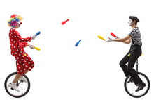 Mime And Clown On Unicycles Juggling With Clubs