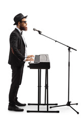 Poster - Male musician playing a digital piano and singing on a microphone