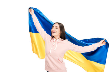 Wall Mural - happy young girl holding flag of Ukraine isolated on white