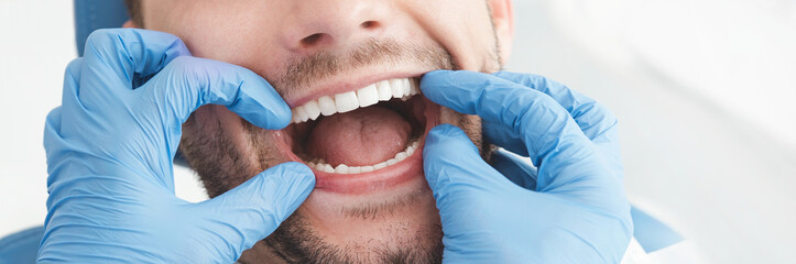 Wall Mural - Man having teeth examined at dentists