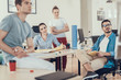 © Yakobchuk Olena - Happy colleagues discussing scheme of startup development