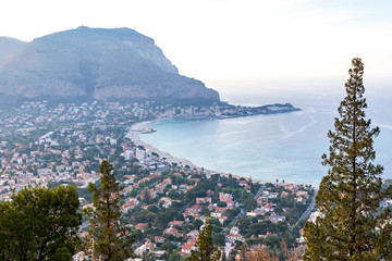 Wall Mural - Panoramic aerial evening view of Mondello beach (Spiaggia di Mondello) in Palermo, Sicily, Italy. Beach lies between two cliffs called Mount Gallo and Mount Pellegrino. View from Mount Pellegrino