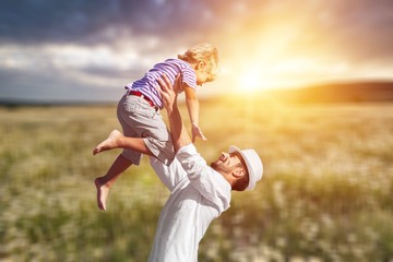 Wall Mural - Family happy outside sunset vacation lifestyle hug