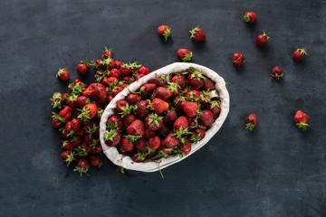 Wall Mural - fresh raw strawberry in the tray, organic healthy food on dark background