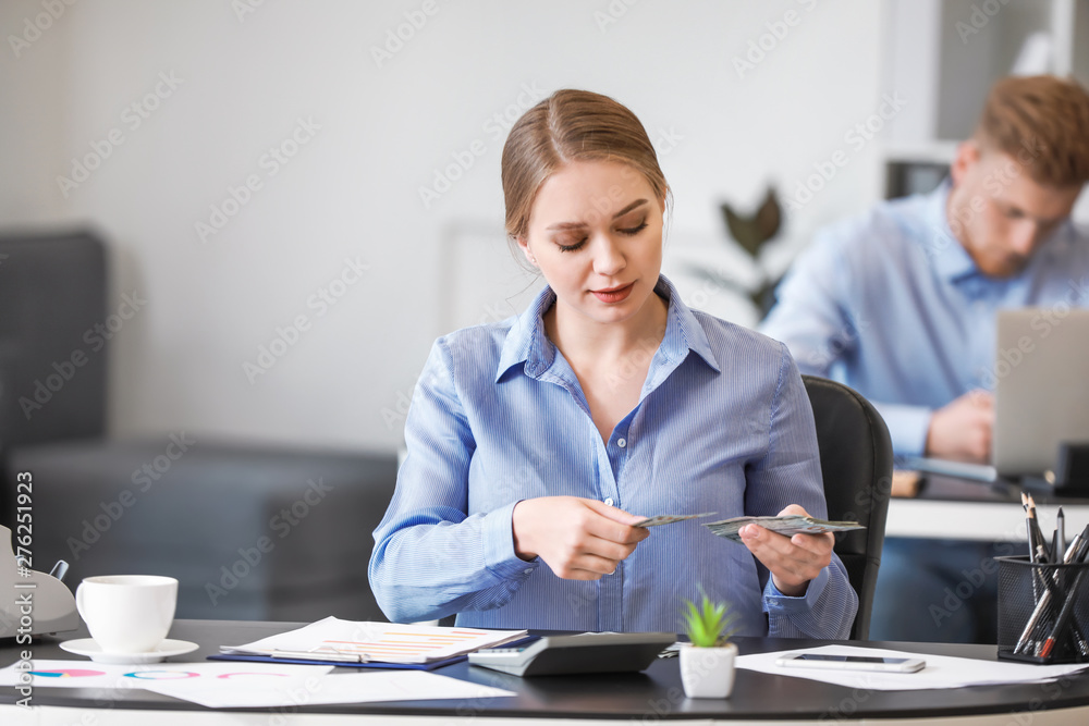 Female accountant working in office